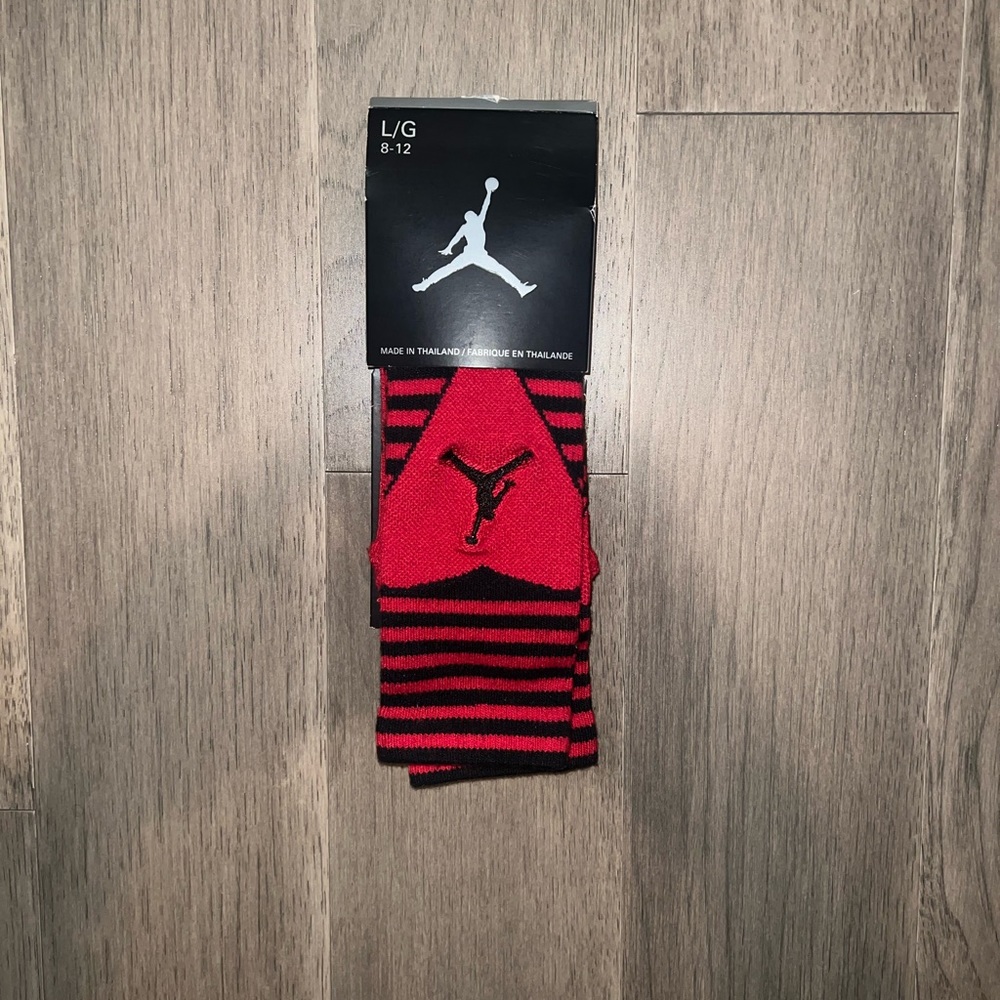 Brand new black and red Jordan socks. Mens size large. 8-12 shoe size.